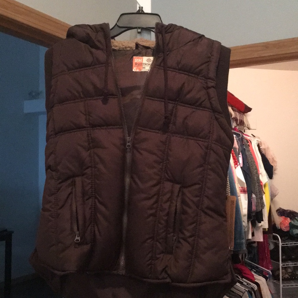 Fur hooded brown vest.